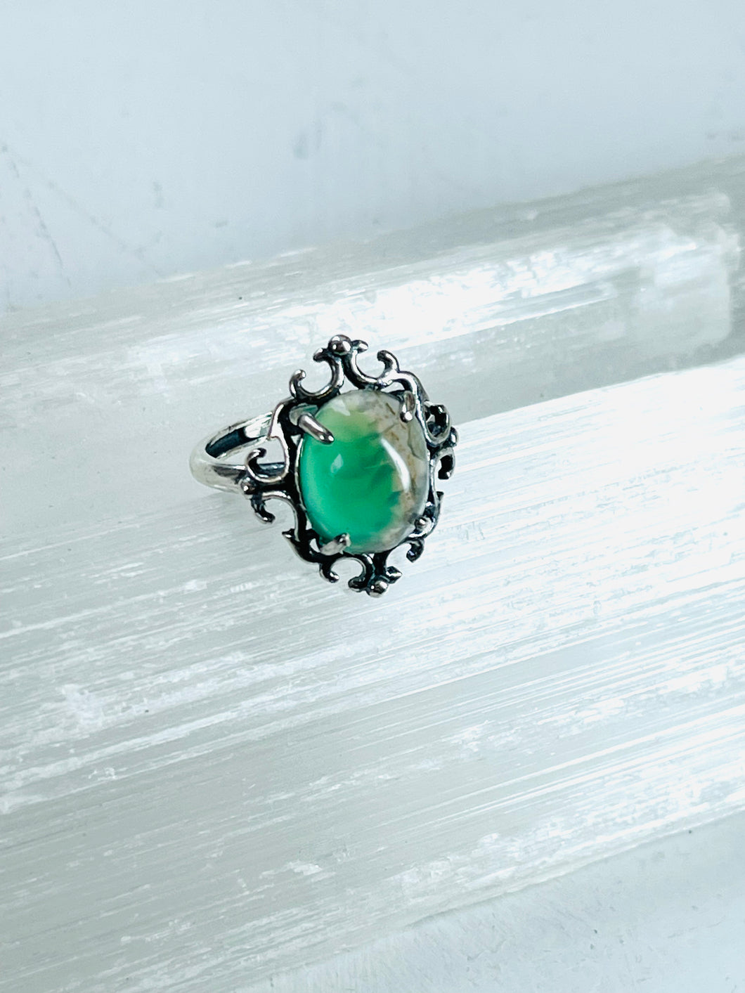 Ring with bright green opalized wood