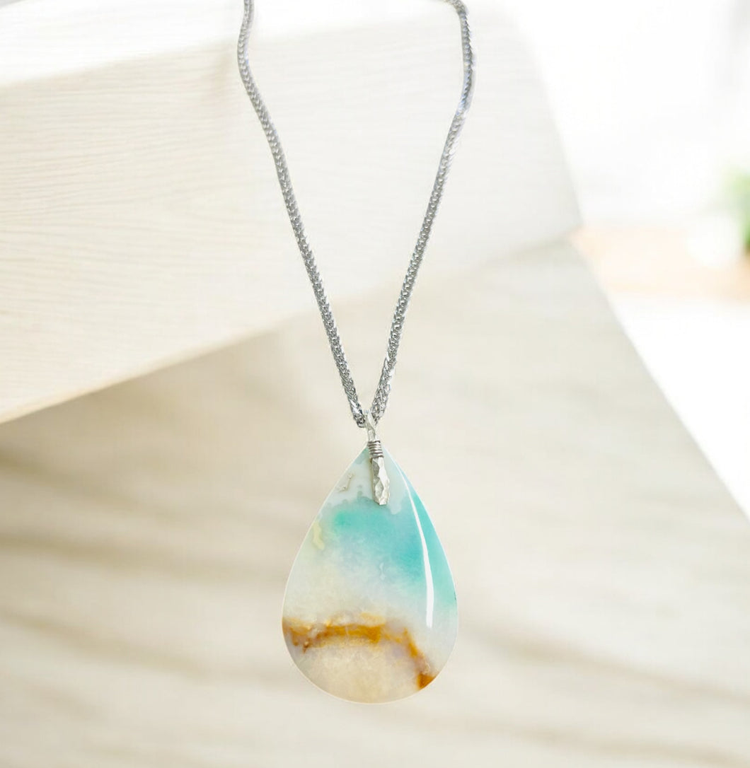 Pendant with long tear drop light color Opalized wood