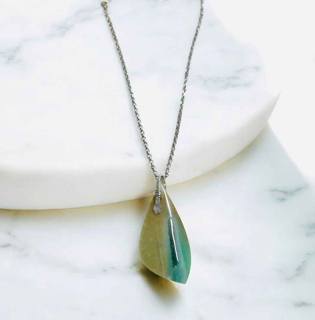 Pendant with Opalized Petrified wood and blue light color patterns