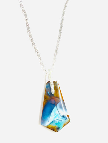 Pendant with Opalized Petrified wood and blue light color patterns