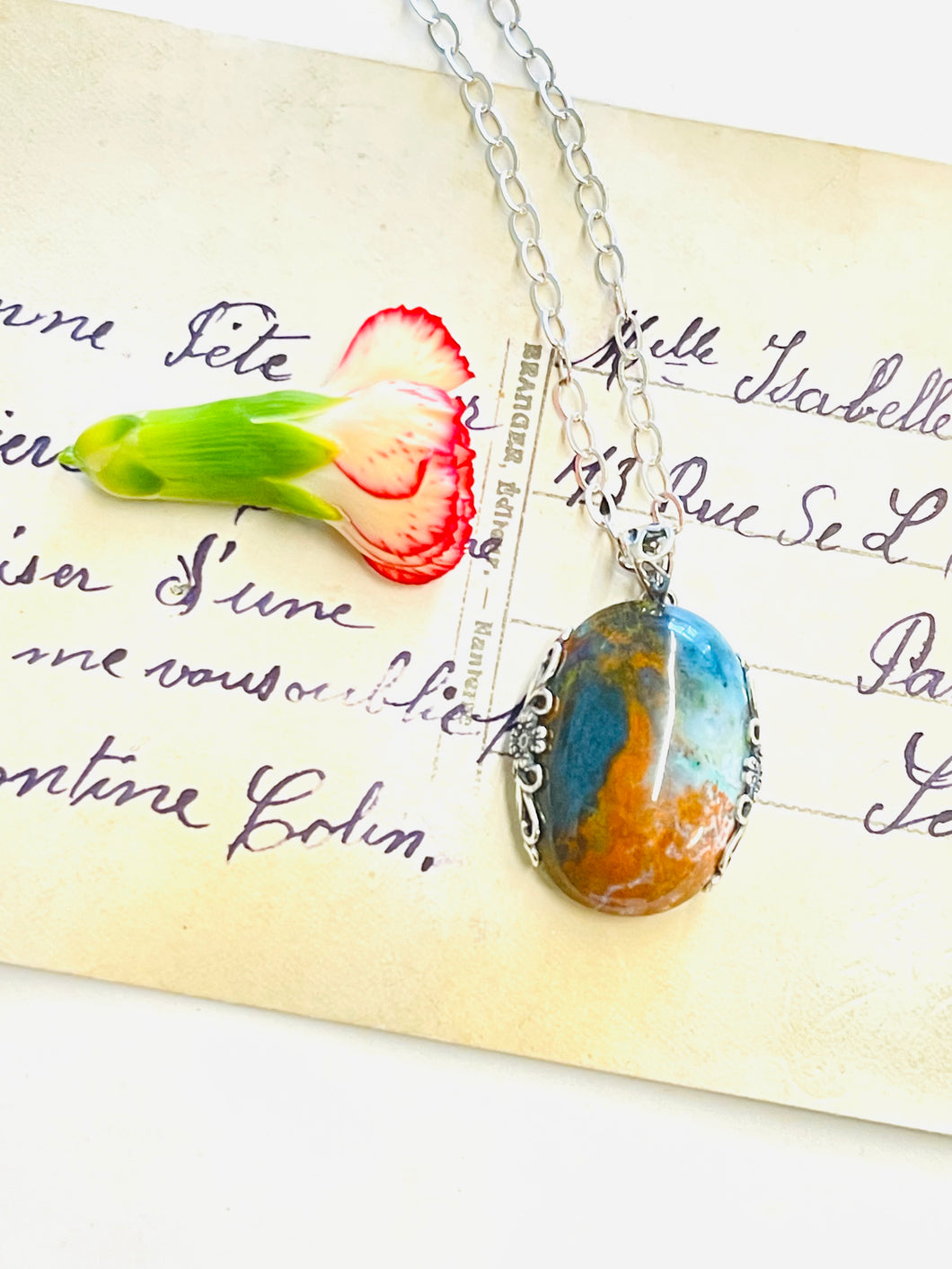 Pendant with Opalized Petrified wood and blue light color patterns