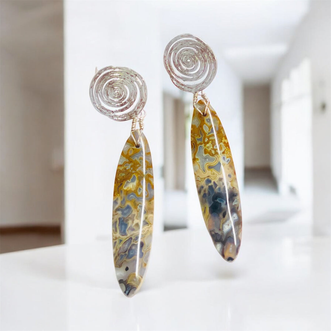 Earrings with petrified palm root