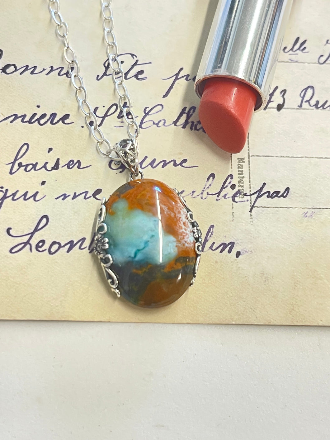 Pendant with Opalized Petrified wood and blue light color patterns