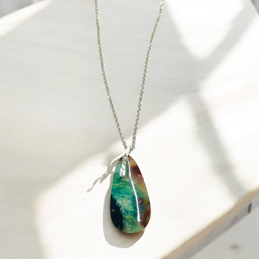 Pendant with dark petrified opalized wood