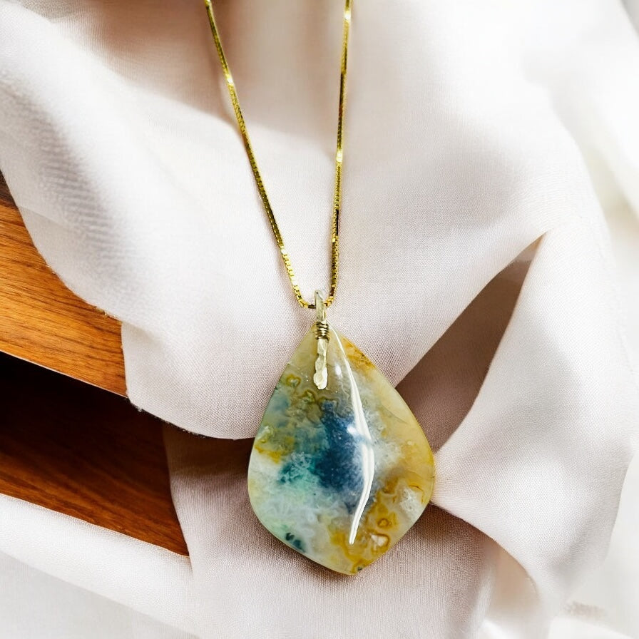 Pendant with light colors petrified opalized wood