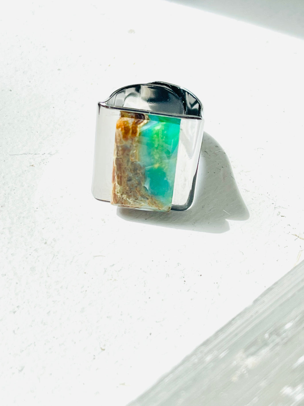 Ring with square turquoise dark opalized wood