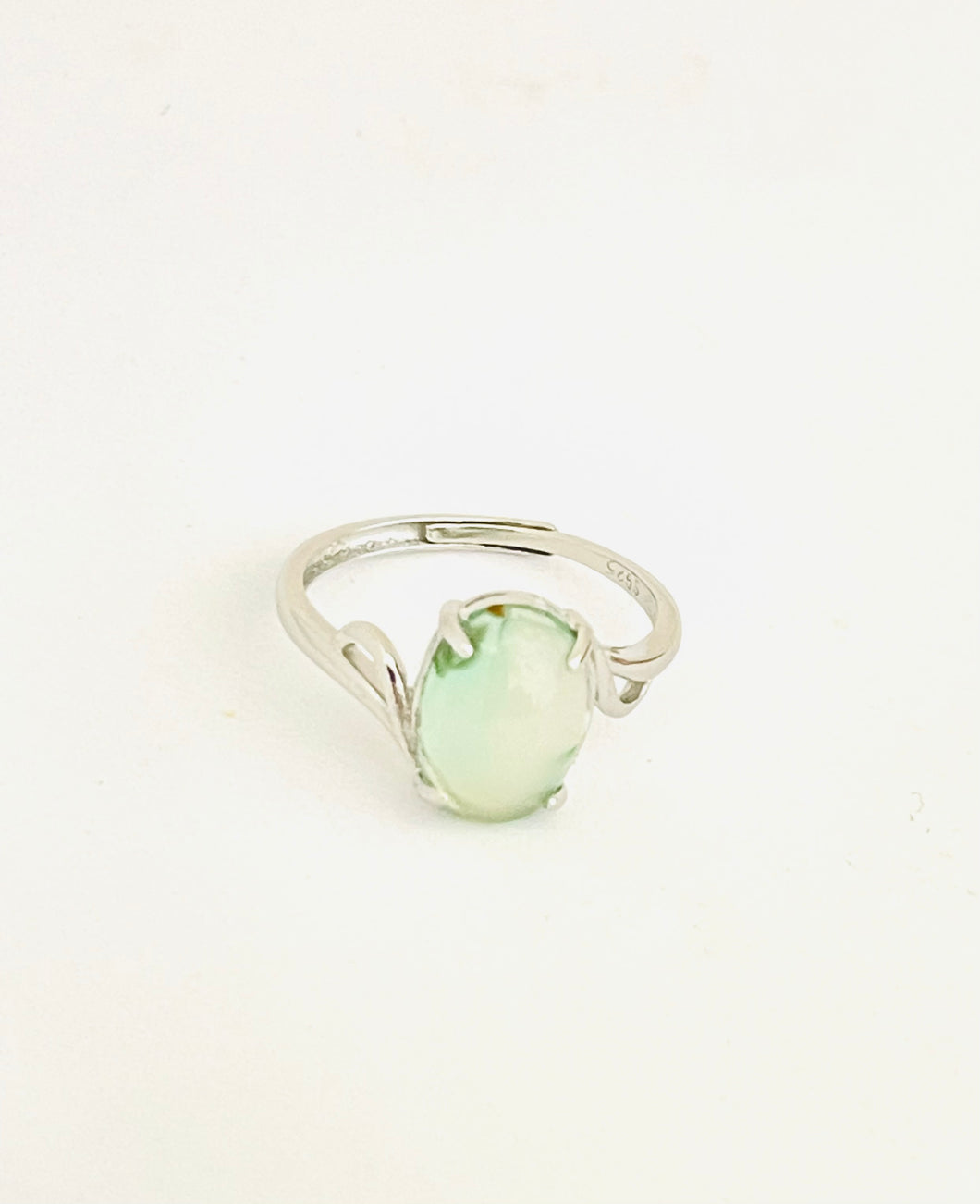 Ring with light green opalized wood
