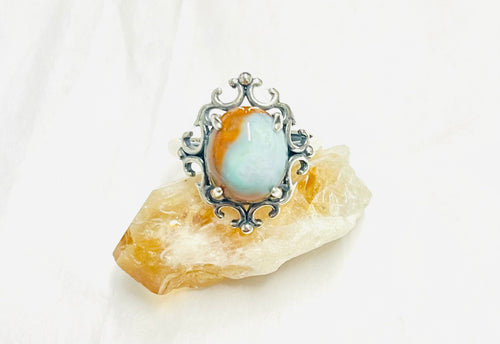 Ring with blue opalized wood