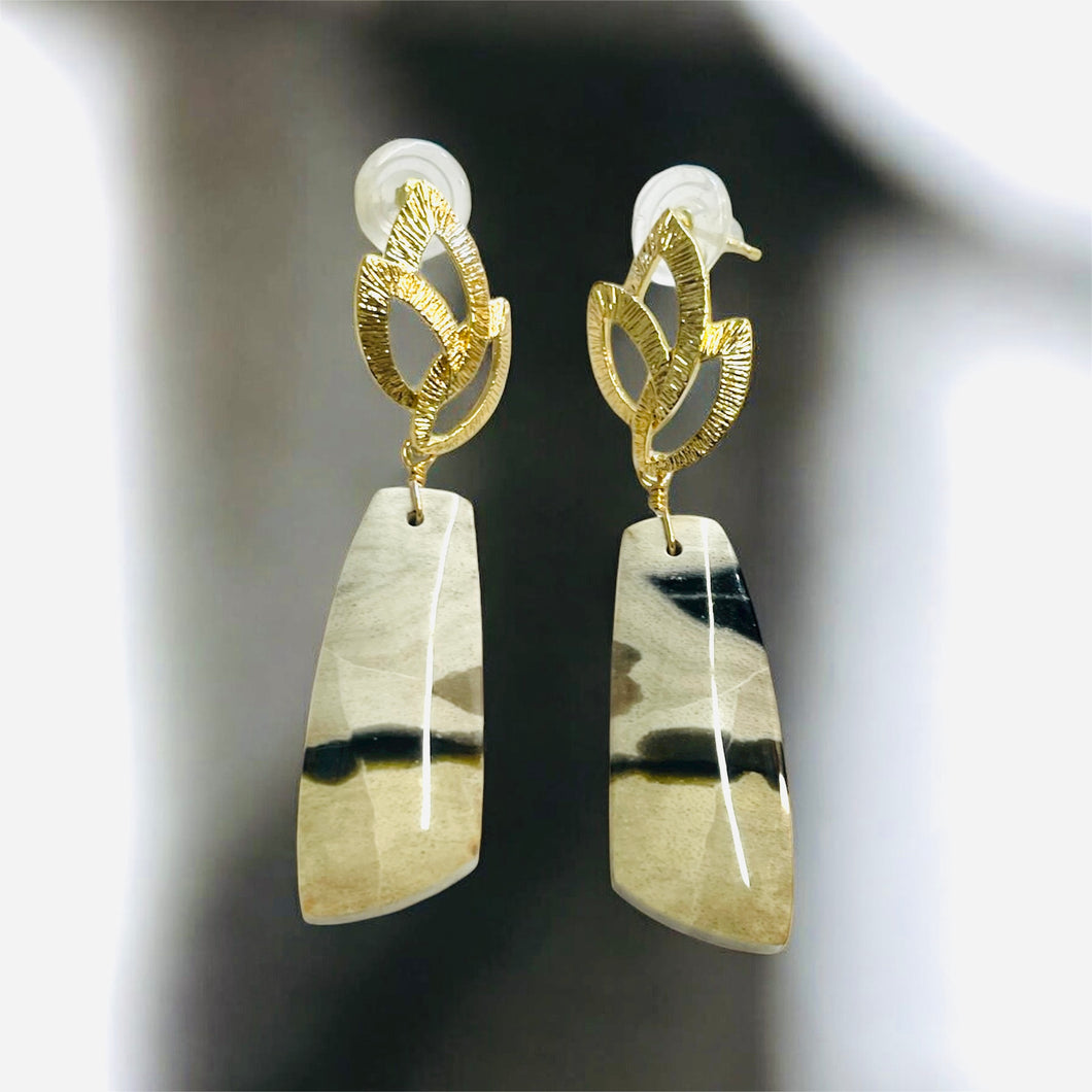 Earrings with petrified palm root
