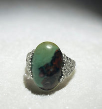 Ring with opalized petrified wood cabochon