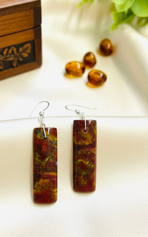 Earrings with red opalized wood