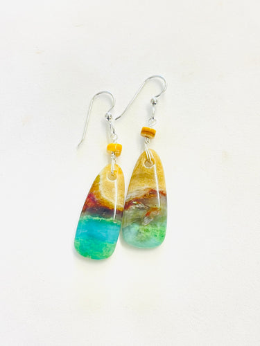 Earring with light colored opalized wood