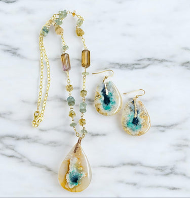 Necklace with light blue opal wood and various stones