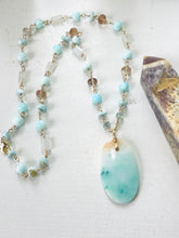Necklace with petrified opalized wood artistic pattern