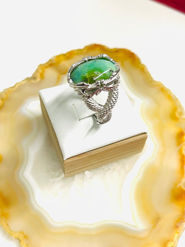 Ring with deep green opalized wood
