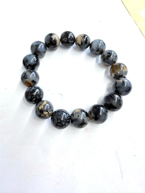 Bracelet with petrified pine root