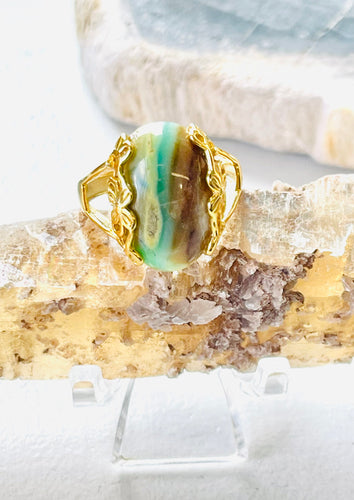 Ring with green brown opalized wood