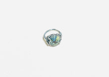 Ring with light colors agatized blue opal wood
