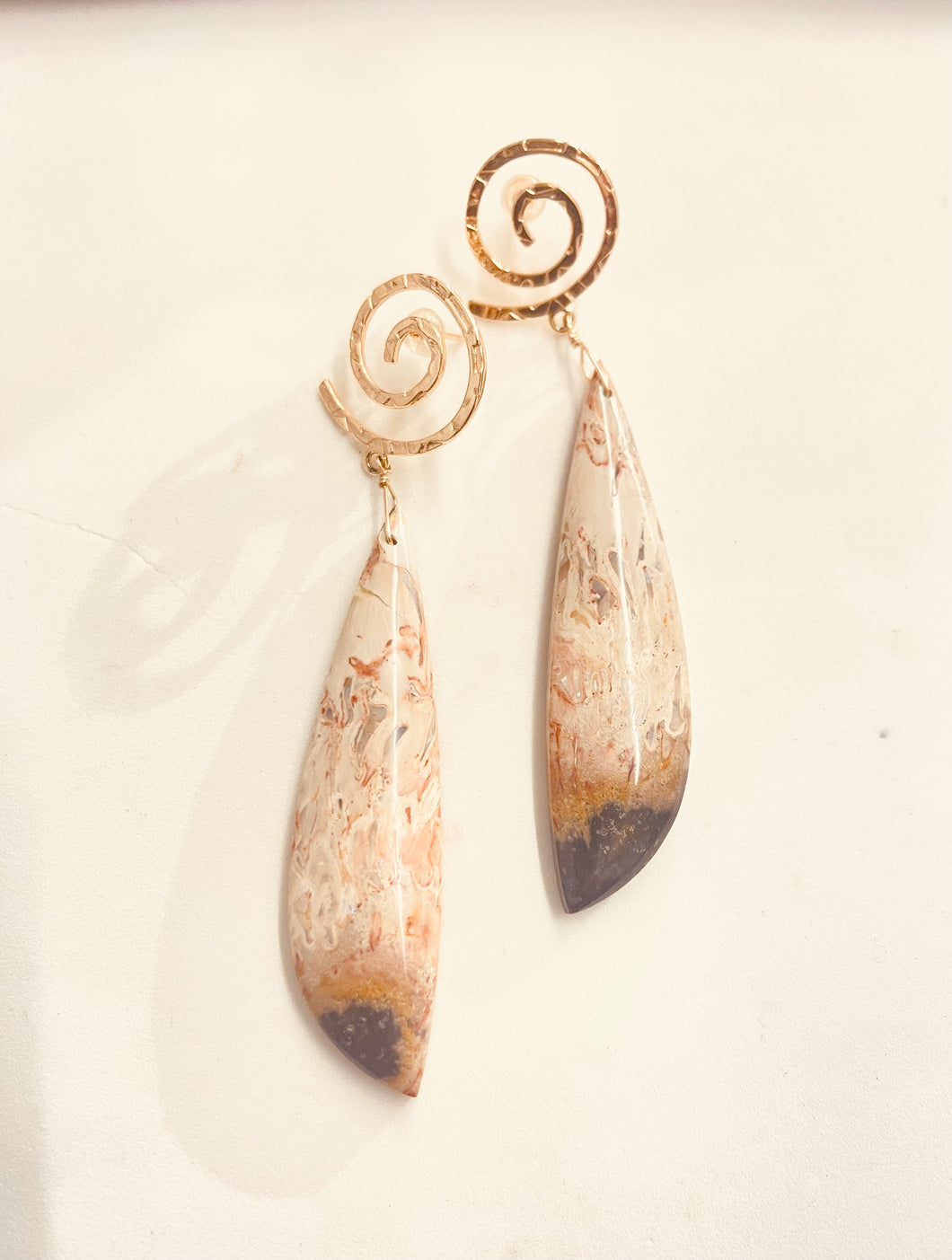 Earrings with petrified palm root