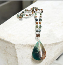Necklace with dark green and woody colors in the petrified opalized wood