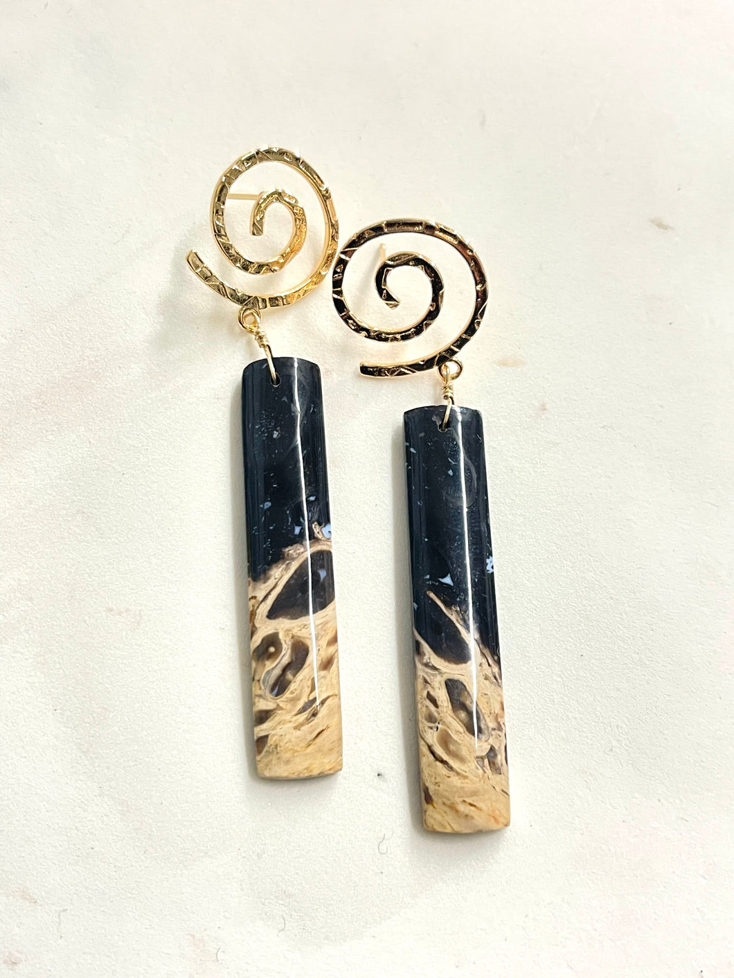 Earrings with petrified palm root