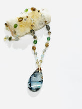 Necklace with colorful opalized wood and various gem stones
