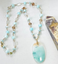 Necklace with petrified opalized wood artistic pattern