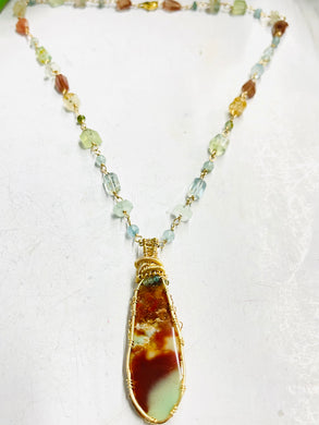 Necklace with colorful opalized agatized wood