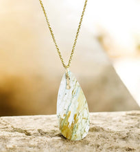 Pendant with white petrified wood from Java