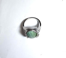 Ring with petrified opalized wood
