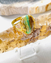 Ring with green brown opalized wood