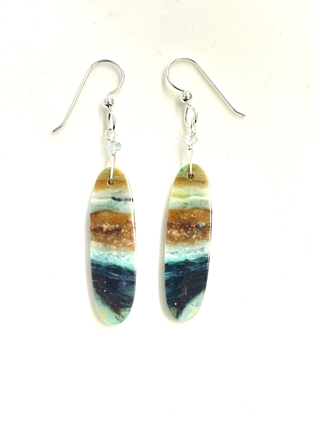 Earrings with petrified opalized wood with copper