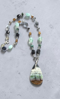 Necklace with opalized wood and various stones