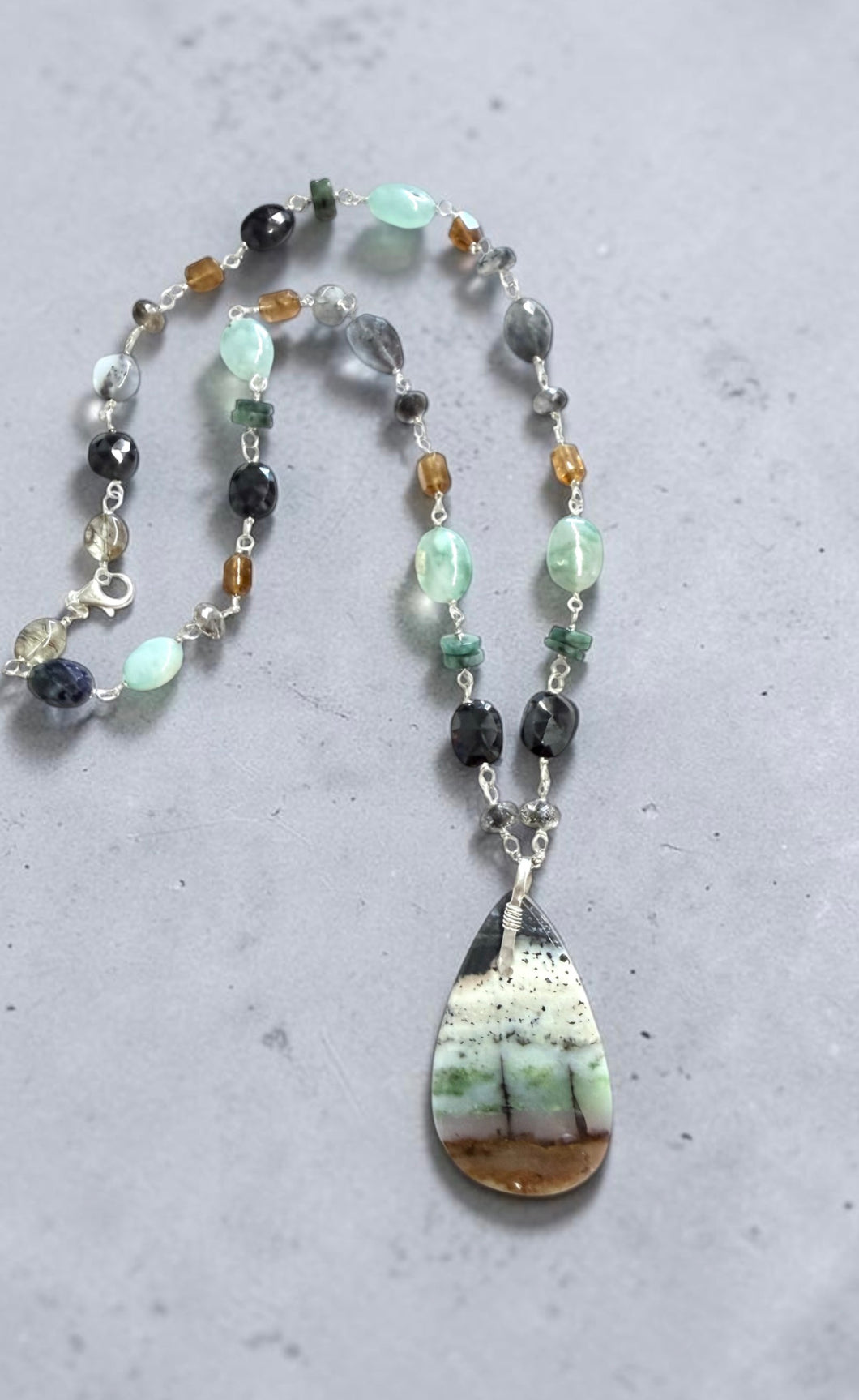 Necklace with opalized wood and various stones
