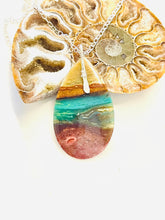 Pendant  with dark colors petrified opalized wood