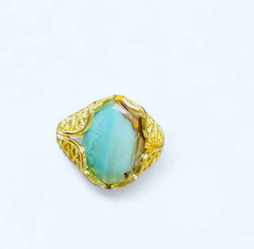 Ring with blue brown opalized wood