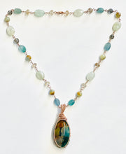 Necklace with baby blue colors opalized wood