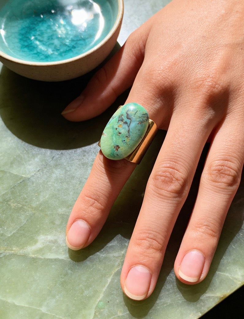 Ring with oval petrified opalized wood cabochon