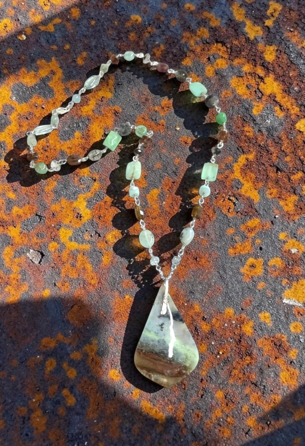 Necklace with opalized wood and various stones