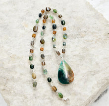 Necklace with dark green and woody colors in the petrified opalized wood
