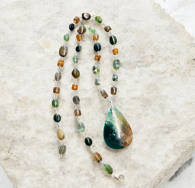 Necklace with dark green and woody colors in the petrified opalized wood