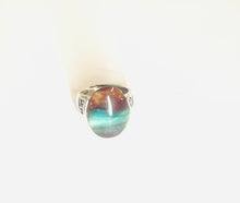 Ring with dark opalized wood cabochon