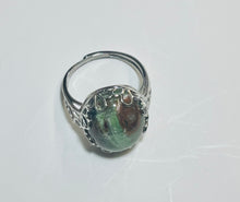Ring with opalized petrified wood cabochon