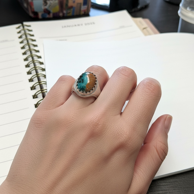 Ring with opalized petrified wood cabochon
