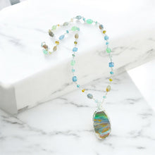 Necklace with copper on opalized wood and various stones
