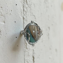 Ring with petrified opalized wood