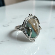 Ring with petrified opalized wood