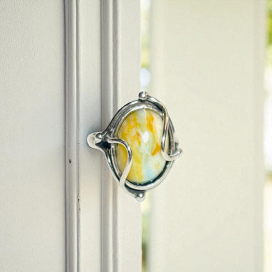 Ring with petrified opalized wood