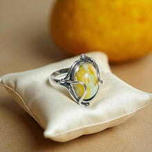 Ring with petrified opalized wood