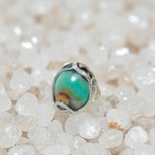 Ring with opalized petrified wood cabochon